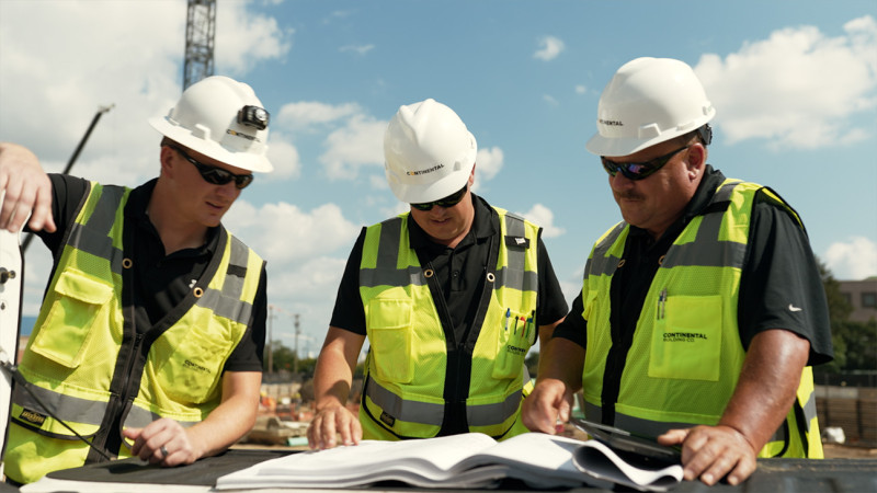 CBC mentor helping younger employee.