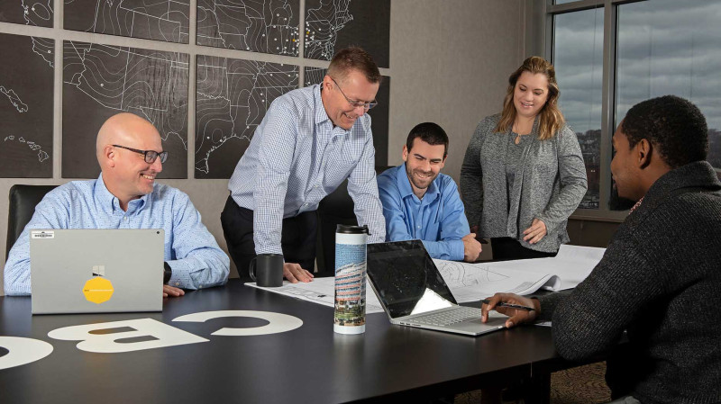 Employees meeting around table