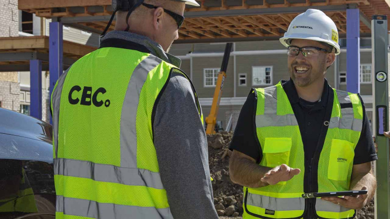 CBC teammates working with a tablet.