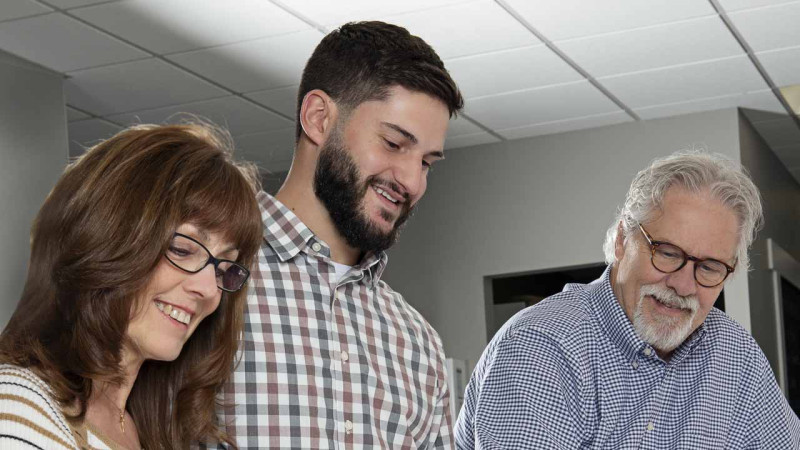 CBC teammates reviewing blueprints.